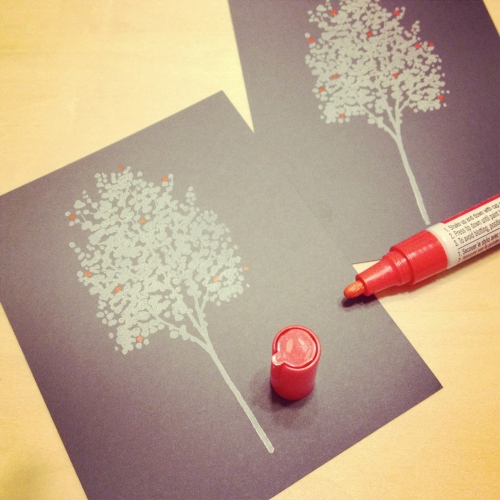 Using a red paint pen I added dots to resemble ornaments on each tree.